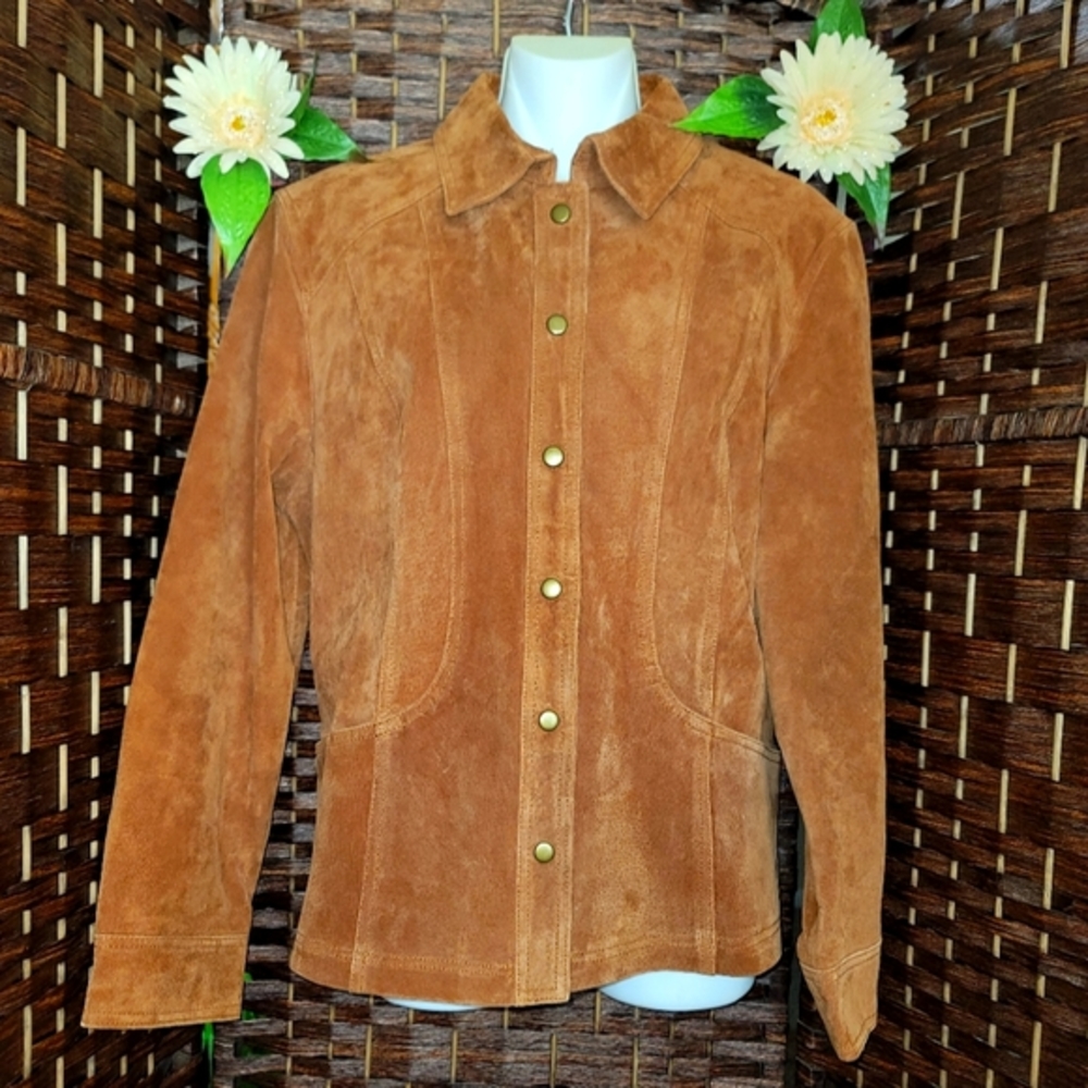 Coldwater Creek leather jacket It has pockets. It is yellow-brown in color. It i